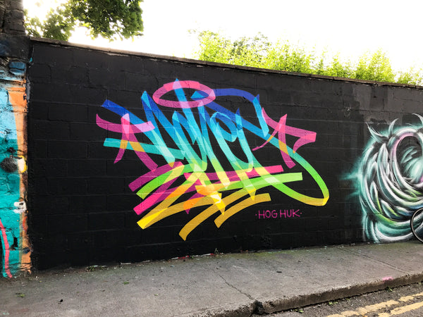 ACHES Graffiti Artist - Mural on Black Background