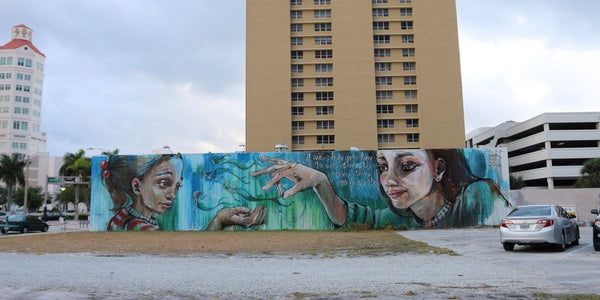 HERAKUT mural for CANVAS Outdoor Museum Mural Festival