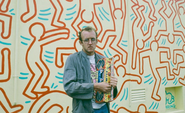 Keith Haring Standing in front of one of his murals