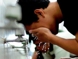 A man taking his wudhu' (ablution)