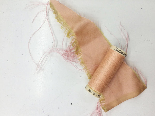 Peachy pink thread