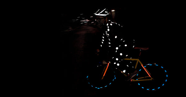RydeSafe Reflective Buttons on a bike rider