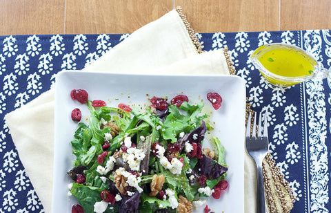 olive oil dressing with greek salad in a bowl