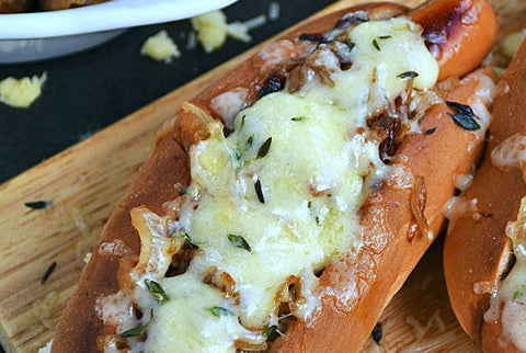 french onion hot dogs in a plate with cheese