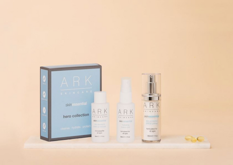 Product Image of ARK Skincare's Hero Collection box on a marble slate alongside 1 mini hydrating beauty mist, 1 mini pre-cleanse and makeup remove and 1 full size SPF.