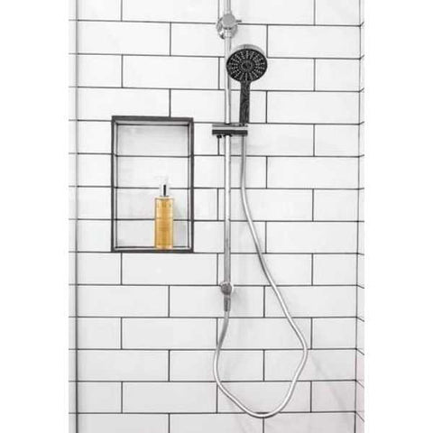 Shower handle against a fresh white tiled bathroom wall. 