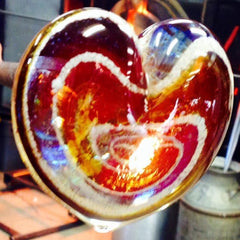 glass heart paperweight with ash