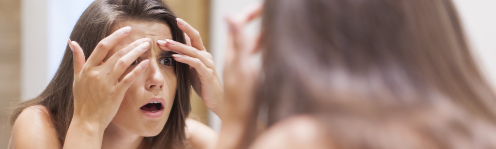 girl looking in mirror