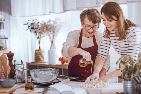 a mom and her mother cooking together