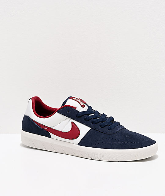 navy blue and red nike shoes