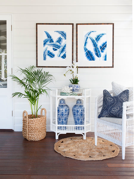 Hampton style bedroom with blue banana palm leaf wall art by Kerri Shipp Driftwood Interiors
