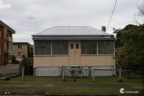 Queenslander worker's cottage exterior before renovation driftwood interiors