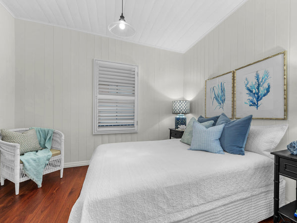 Hampton style bedroom with blue coral wall art by Kerri Shipp Driftwood Interiors