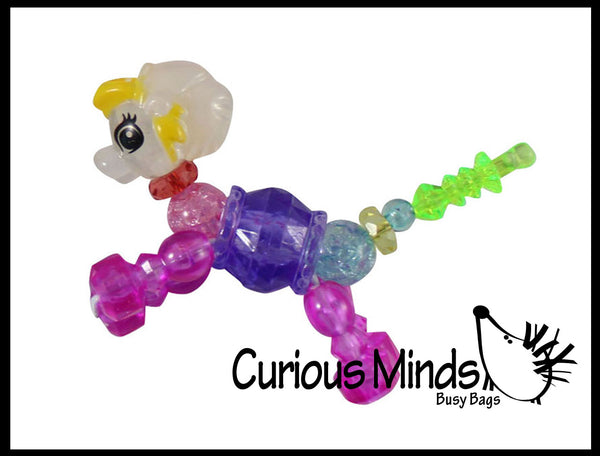 toy animals that turn into bracelets