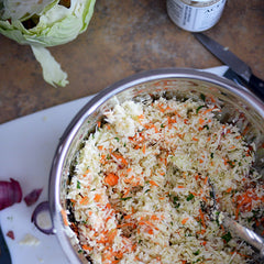 Mix the cabbage, carrots, onion, and parsley in a large bowl.