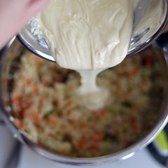  Pour the dressing into the salad in the large bowl, and mix it until all of the dressing is incorporated.