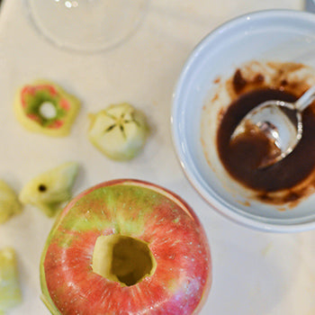 Step 2: Slice the apple horizontally and core it; mix the brown sugar, cinnamon, vanilla, and rum or bourbon in a small bowl.