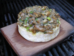 Place your Brie on top of the cedar plank once it's started to smoulder