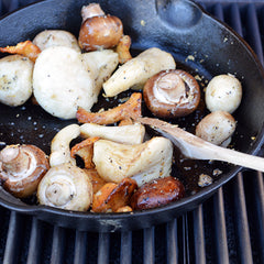 Mushrooms being sautéed on the barbecue