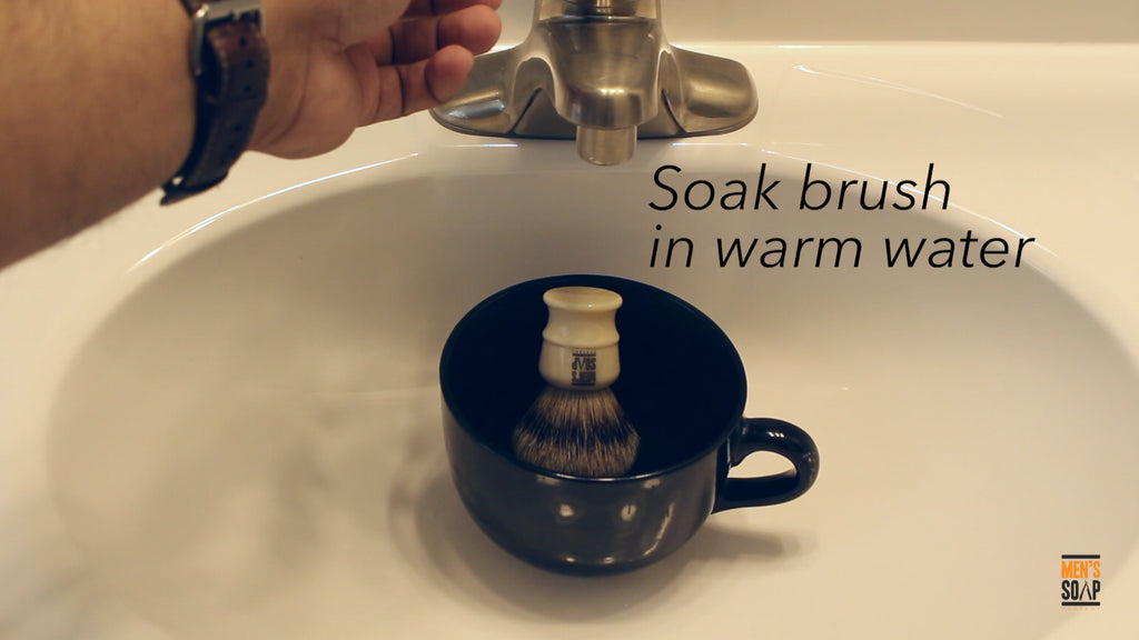 Soak shaving brush in warm water for a few minutes.