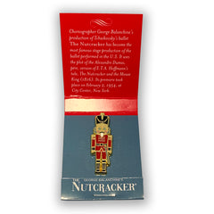 Nutcracker Pin in Open Matchbook Style Packaging