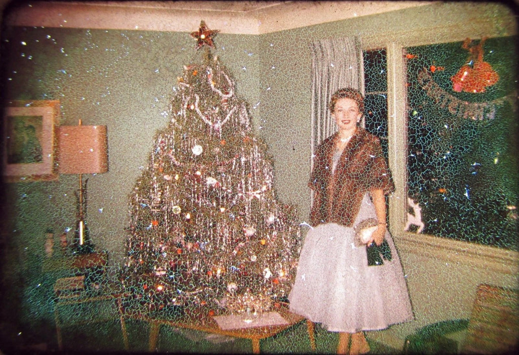 Vintage Christmas tree picture woman standing by