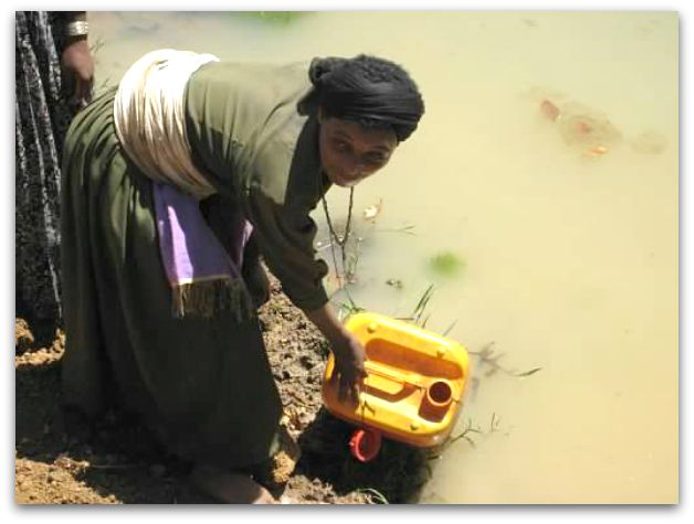 A Woman collecting water in Ethiopia