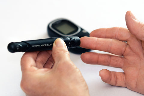 Person using blood sugar measuring device