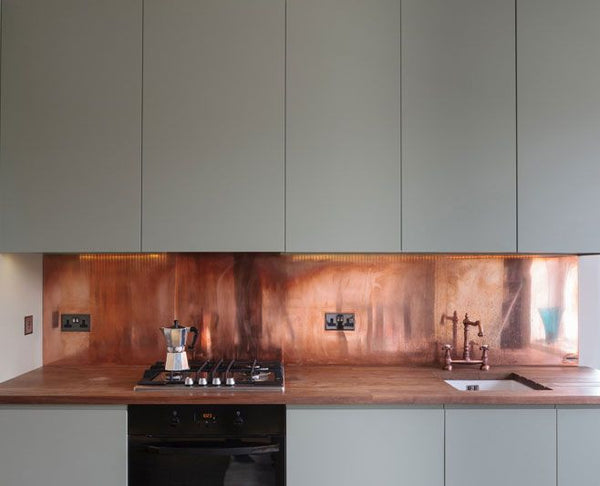 hammered copper backsplash beige kitchen cabinet copper farmhouse sink