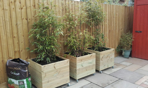 Wooden planter on wheels / casters