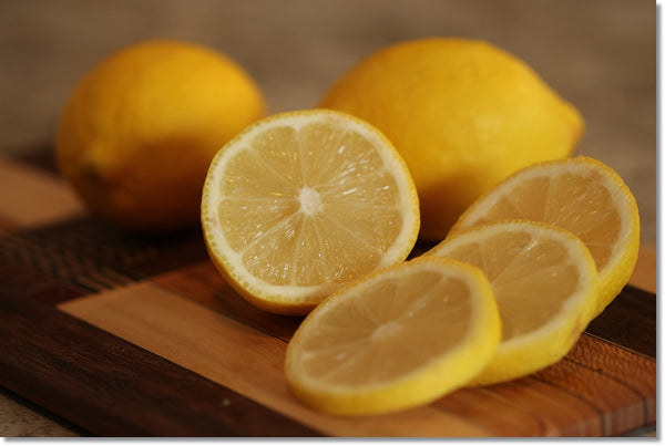 clean cutting board with lemon and salt
