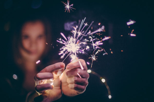 Person Holding Sparklers