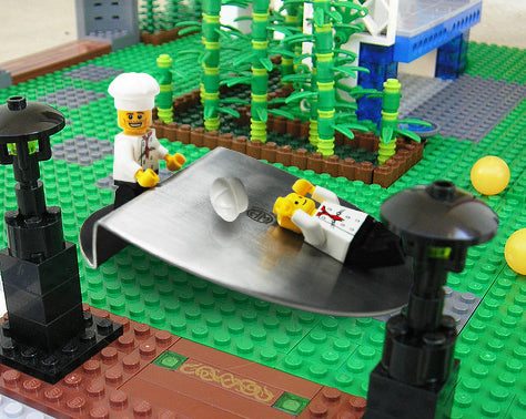 lego chef using tasting plate as slide