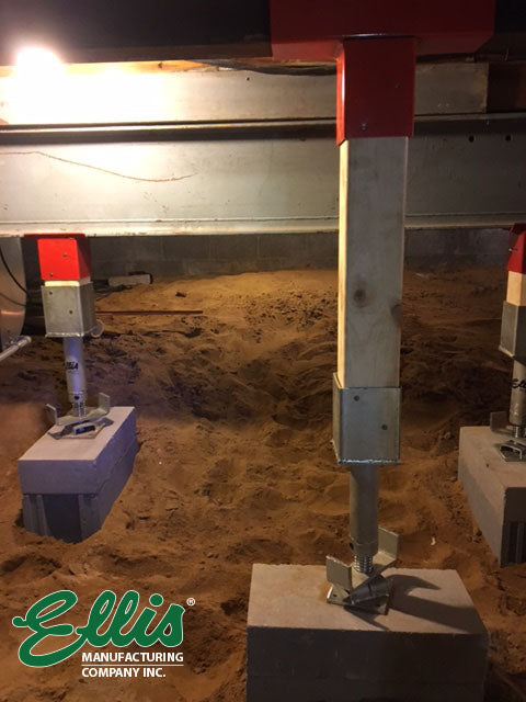 Ellis Screw Jack Posts in Crawlspace supporting floor in home