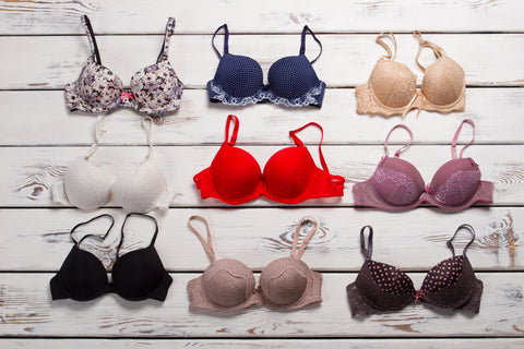 Different bras on timber board