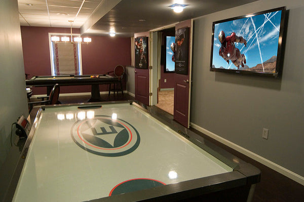 a well-maintained air hockey table set up in a living room
