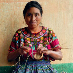 Mayan Hands basket maker wearing huipil