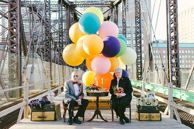 grandma and grandpa with balloons