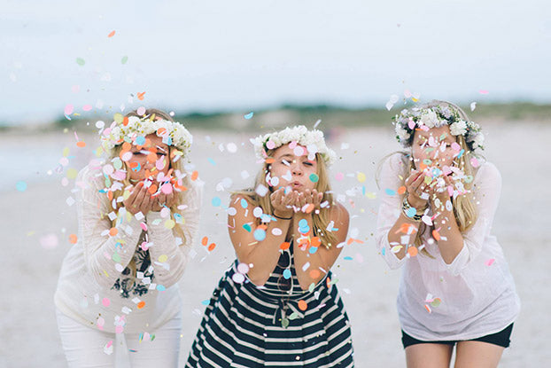 wedding blowing confetti