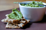 Pea and Toasted Walnut Pate in a bowl, with some smeared on some crackers nearby - Renee's Garden