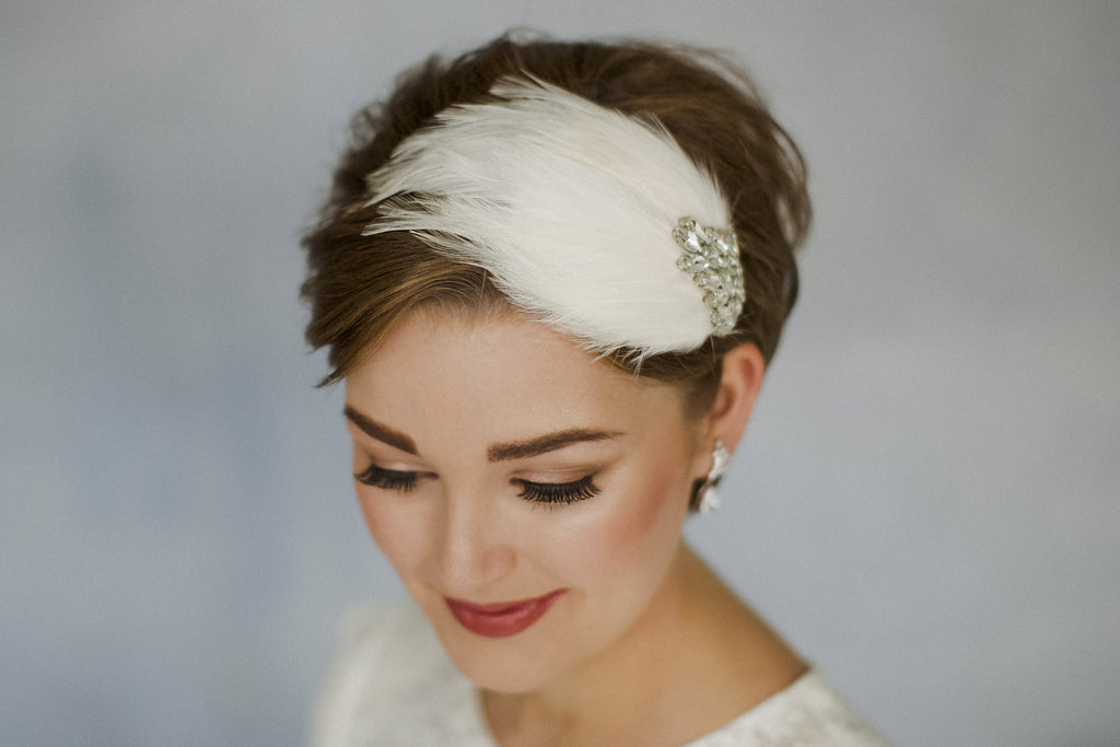 Short haired bride in a feather wedding headband with Swarovski crystals 