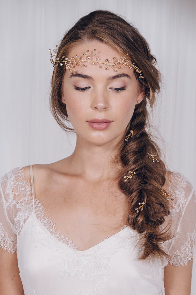 bridal plait or wedding braid with hairvine and hair pins woven in