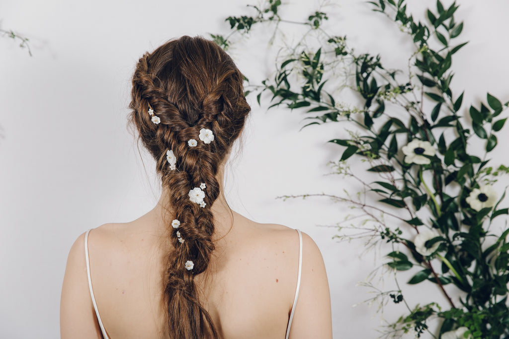 bridal hair plait with flower hair pins