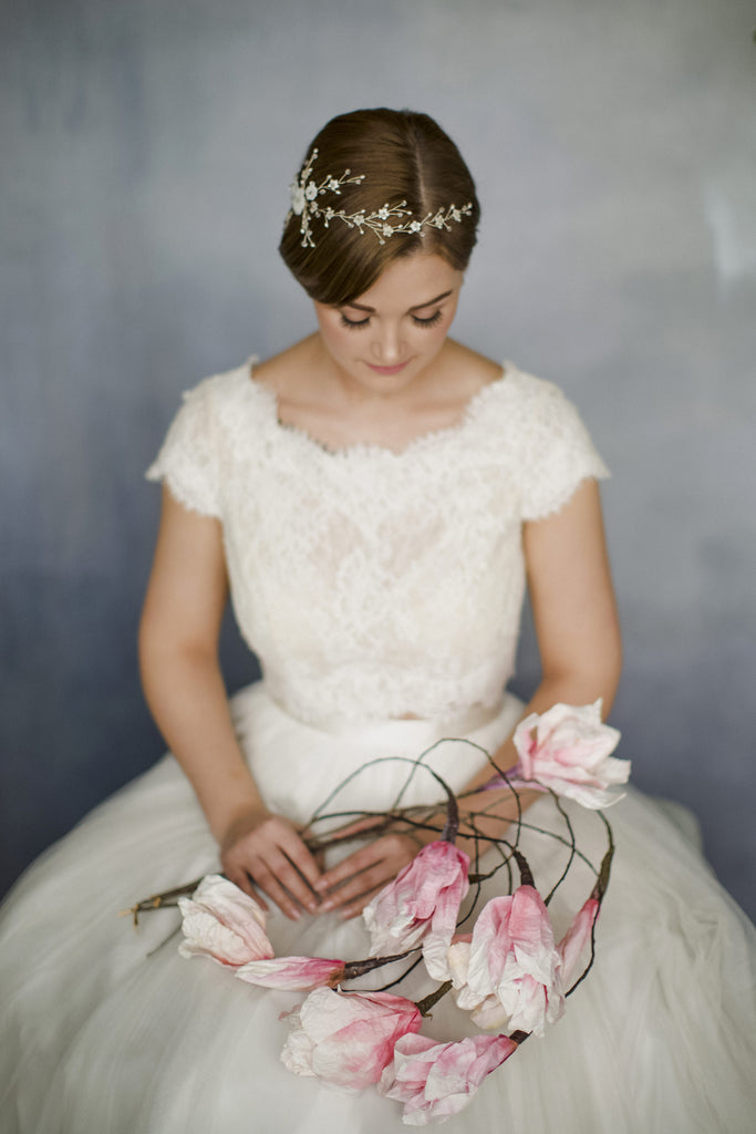 Floral wedding hair vine trailing around short hair for inspiration for short haired brides