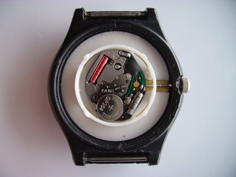 quartz watch with open case back