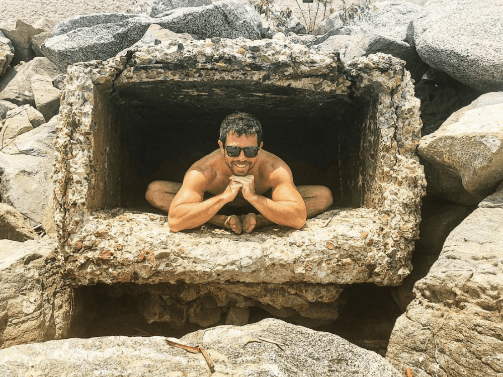 jordan berger yoga pose in cave