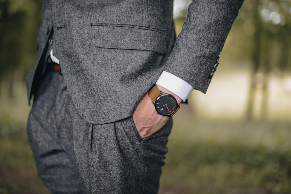 Charcoal grey suit, with a nice watch