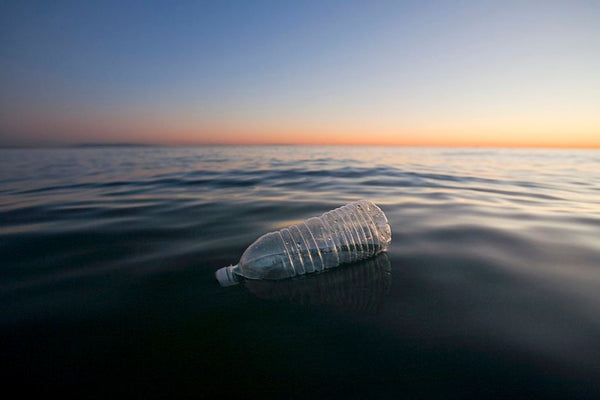 Plastic bottle floating ocean