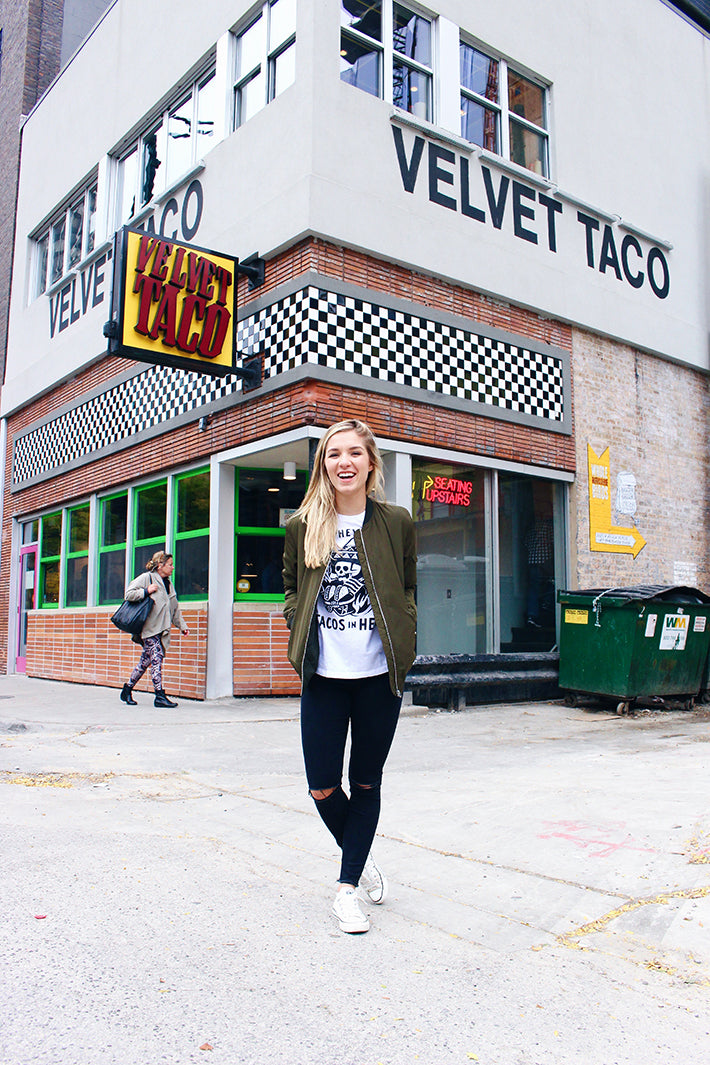 The Nom Stop outside her favorite taco joint, Velvet Taco, in Chicago, IL