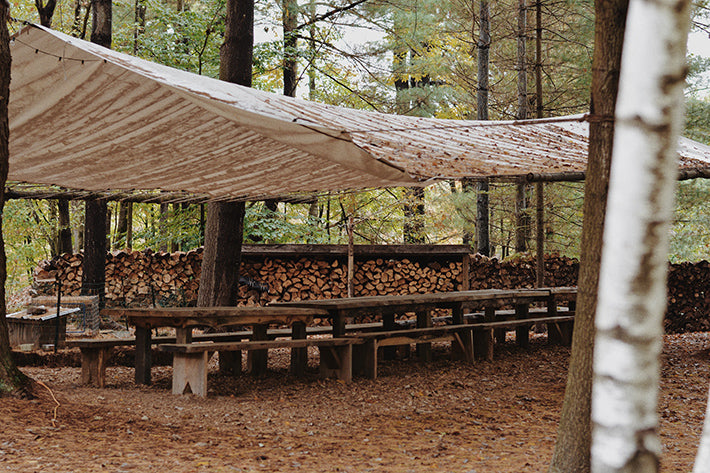 the outlier inn outdoor farm rustic reclaimed wood dining area - glamping airbnb catskills upstate ny 